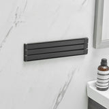 NordRack towel rack mounted on bathroom wall | Minimalist non-drill towel rack in Nordic style | Adhesive towel rack holding white towel | Nordic-style rack for towels and accessories | Wall-mounted towel holder without drilling | Compact towel rack in modern bathroom | Rust-resistant adhesive towel rack | NordRack above sink in small bathroom

