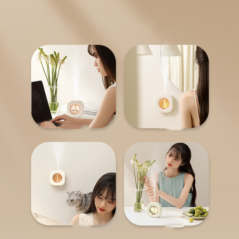 Wall-mounted aroma diffuser | ScentMount on desktop releasing mist | Compact essential oil diffuser | Aroma diffuser with LED light | Automatic scent diffuser on table | Mounted diffuser in modern room | ScentMount with essential oils | Quiet ultrasonic diffuser in use