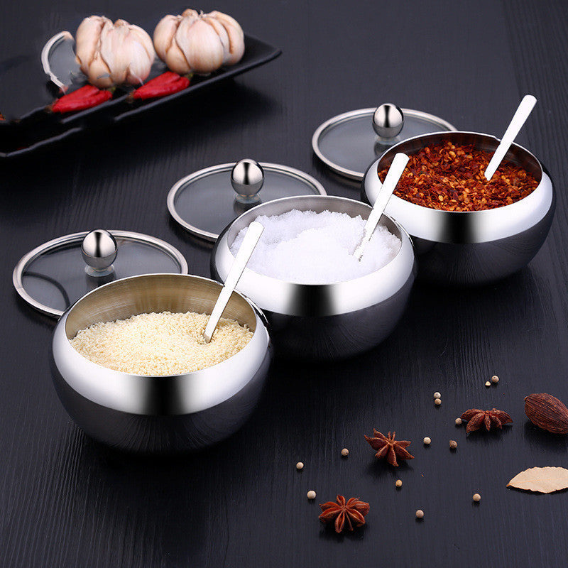 FlavorVault stainless steel seasoning pot with lid | Kitchen spice container holding salt and pepper | FlavorVault used to store herbs and spices | Compact stainless steel spice jar on countertop | Seasoning pot with airtight lid for freshness | FlavorVault spice pot with modern kitchen design | Sleek stainless steel container for kitchen spices | FlavorVault holding ground pepper and curry powder | Durable spice storage pot with easy-grip lid | FlavorVault seasoning pot beside cooking utensils

