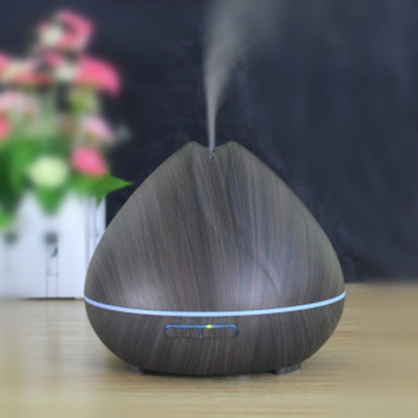 ConchBreeze diffuser releasing essential oil mist | Shell-shaped aroma diffuser with LED light | Conch diffuser on wooden nightstand | Coastal-style ultrasonic diffuser for home use | Essential oil diffuser with seashell design | Compact conch aroma diffuser in modern room | ConchBreeze diffuser glowing with soft light | Aromatherapy diffuser shaped like a conch shell | Stylish shell diffuser for home relaxation | Ultrasonic conch diffuser with calming mist effect