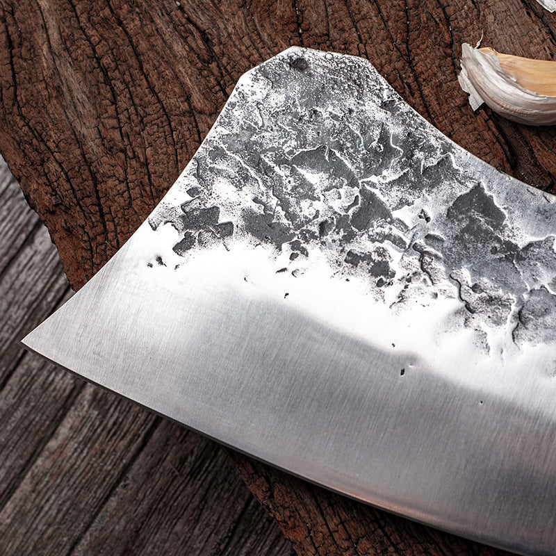 BladeCraft stainless steel chef knife on wooden cutting board | Sharp kitchen knife slicing vegetables with precision | Ergonomic chef knife with full-tang handle | BladeCraft knife cutting raw meat on butcher block | Stainless steel kitchen knife with sleek, modern design | High-performance BladeCraft knife in home kitchen | Chef holding BladeCraft knife while chopping herbs | Close-up of BladeCraft blade edge and handle grip | Professional-grade knife resting on chef apron | Versatile kitchen knife ideal 