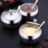 FlavorVault stainless steel seasoning pot with lid | Kitchen spice container holding salt and pepper | FlavorVault used to store herbs and spices | Compact stainless steel spice jar on countertop | Seasoning pot with airtight lid for freshness | FlavorVault spice pot with modern kitchen design | Sleek stainless steel container for kitchen spices | FlavorVault holding ground pepper and curry powder | Durable spice storage pot with easy-grip lid | FlavorVault seasoning pot beside cooking utensils

