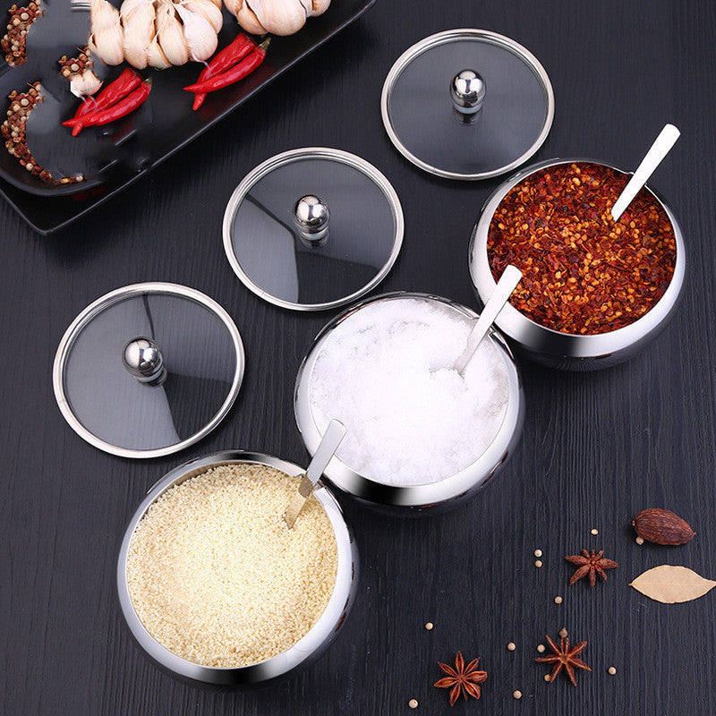 FlavorVault stainless steel seasoning pot with lid | Kitchen spice container holding salt and pepper | FlavorVault used to store herbs and spices | Compact stainless steel spice jar on countertop | Seasoning pot with airtight lid for freshness | FlavorVault spice pot with modern kitchen design | Sleek stainless steel container for kitchen spices | FlavorVault holding ground pepper and curry powder | Durable spice storage pot with easy-grip lid | FlavorVault seasoning pot beside cooking utensils

