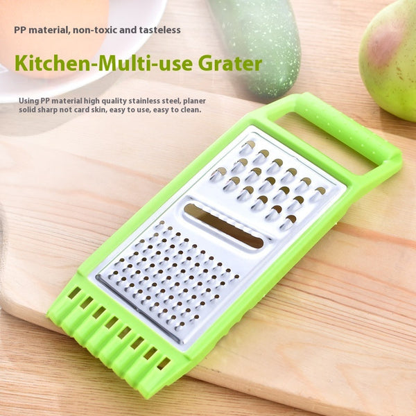 KitchenSwift manual chopper and grater on kitchen counter | Stainless steel blades chopping vegetables in KitchenSwift | KitchenSwift slicing carrots with multi-blade insert | Manual kitchen grater with anti-slip base | Multifunctional chopper dicing onions and garlic | Compact grater and slicer with stainless steel design | KitchenSwift prepping salad ingredients on cutting board | Handheld food chopper with safety handle and blade guard