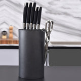 KnifeNest kitchen rack holding knives and utensils | Multifunctional knife and utensil organizer on countertop | Compact knife rack with storage for kitchen tools | KnifeNest shelf with stainless steel knives displayed | Modern kitchen utensil holder and knife stand combo | Space-saving knife organizer in contemporary kitchen | KnifeNest mounted on kitchen wall with tools stored | Durable kitchen rack holding cutlery and cooking tools | KnifeNest with wooden finish and knife slots | Safe knife storage rack 