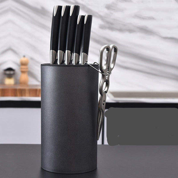 KnifeNest kitchen rack holding knives and utensils | Multifunctional knife and utensil organizer on countertop | Compact knife rack with storage for kitchen tools | KnifeNest shelf with stainless steel knives displayed | Modern kitchen utensil holder and knife stand combo | Space-saving knife organizer in contemporary kitchen | KnifeNest mounted on kitchen wall with tools stored | Durable kitchen rack holding cutlery and cooking tools | KnifeNest with wooden finish and knife slots | Safe knife storage rack 