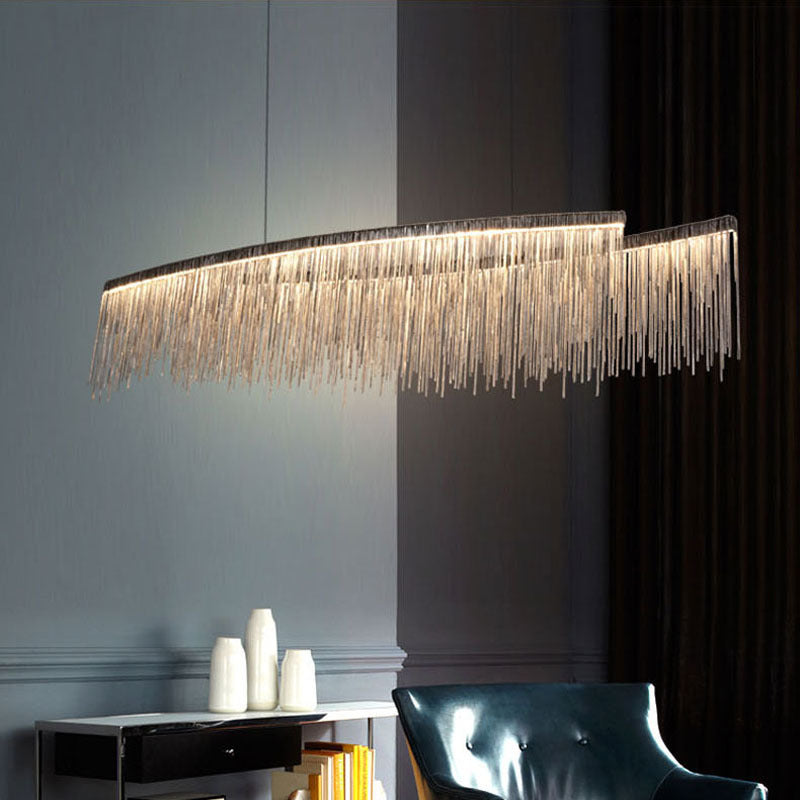 LumaGlow minimalist chandelier in dining room | Modern ceiling light fixture above dining table | Sleek chandelier with warm ambient lighting | Personalized chandelier installed in living room | Minimalist LED chandelier hanging in open space | Custom LumaGlow chandelier above modern dining setup | Elegant black and gold chandelier in minimal interior | Contemporary ceiling light with clean design | Scandinavian-style chandelier lighting a cozy room | Linear pendant chandelier for modern home décor