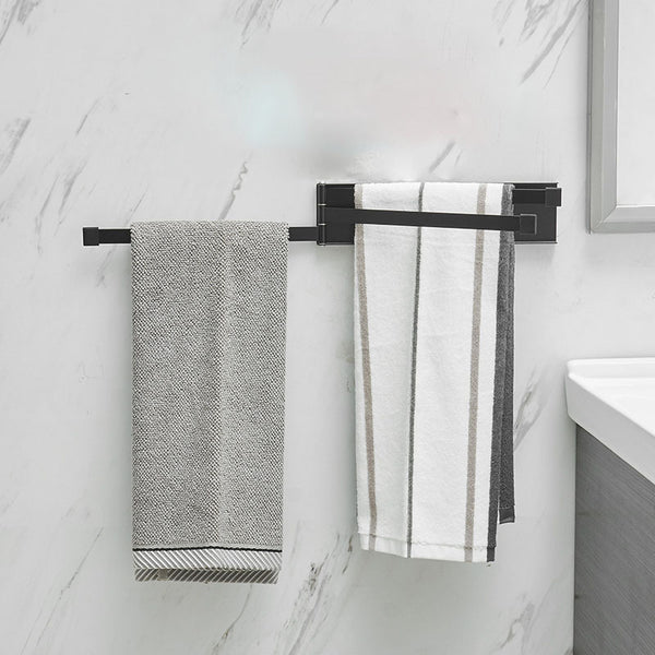 NordRack towel rack mounted on bathroom wall | Minimalist non-drill towel rack in Nordic style | Adhesive towel rack holding white towel | Nordic-style rack for towels and accessories | Wall-mounted towel holder without drilling | Compact towel rack in modern bathroom | Rust-resistant adhesive towel rack | NordRack above sink in small bathroom

