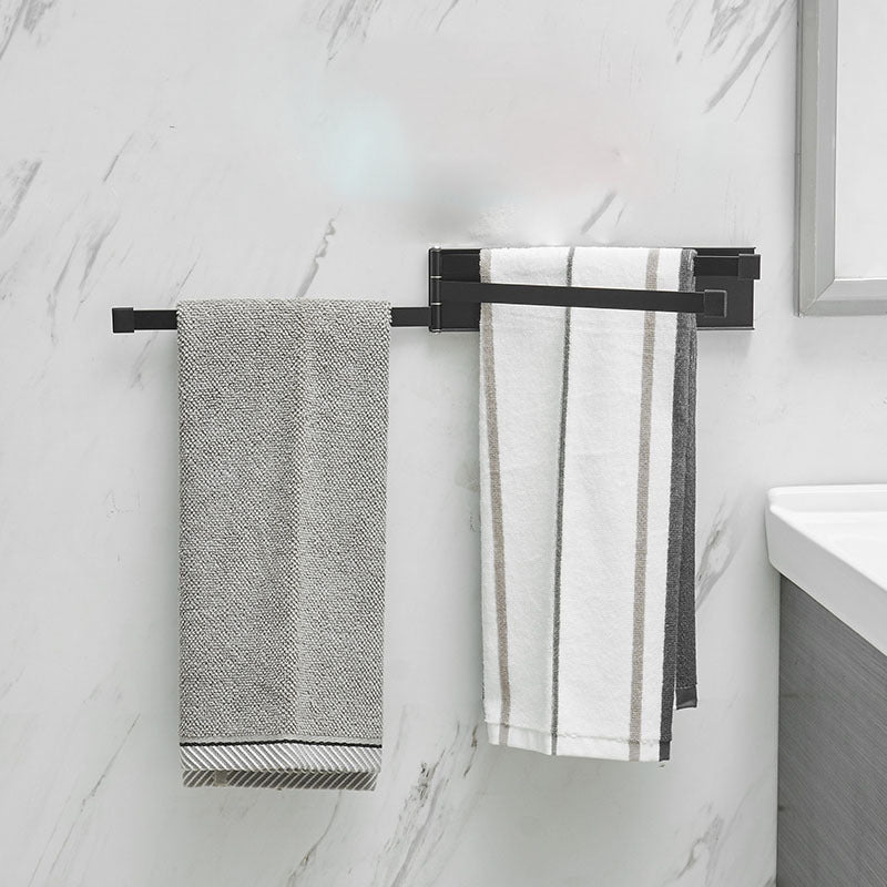 NordRack towel rack mounted on bathroom wall | Minimalist non-drill towel rack in Nordic style | Adhesive towel rack holding white towel | Nordic-style rack for towels and accessories | Wall-mounted towel holder without drilling | Compact towel rack in modern bathroom | Rust-resistant adhesive towel rack | NordRack above sink in small bathroom

