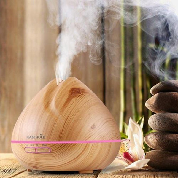 ConchBreeze diffuser releasing essential oil mist | Shell-shaped aroma diffuser with LED light | Conch diffuser on wooden nightstand | Coastal-style ultrasonic diffuser for home use | Essential oil diffuser with seashell design | Compact conch aroma diffuser in modern room | ConchBreeze diffuser glowing with soft light | Aromatherapy diffuser shaped like a conch shell | Stylish shell diffuser for home relaxation | Ultrasonic conch diffuser with calming mist effect