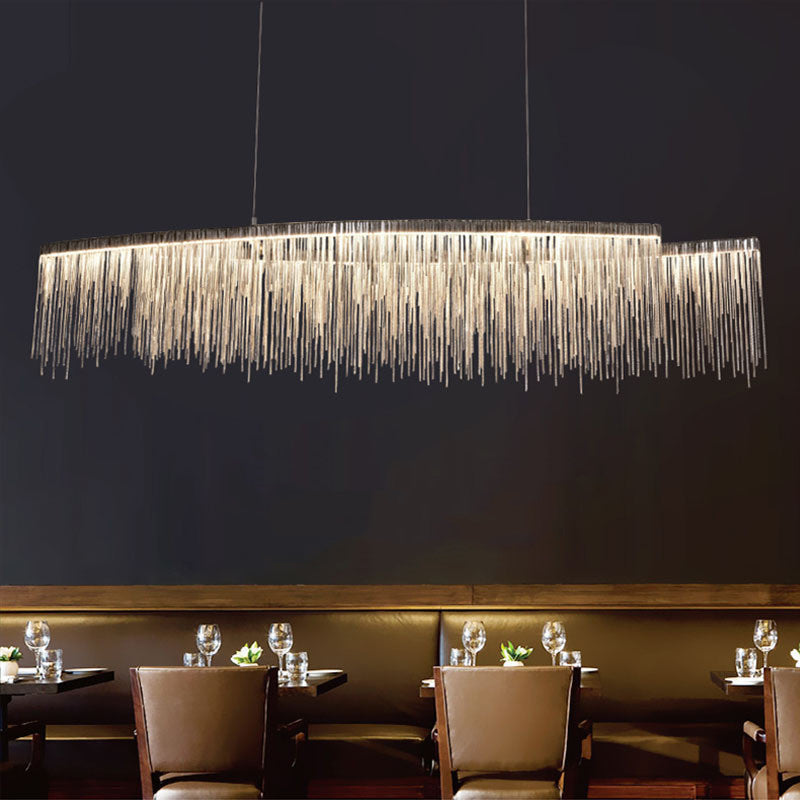 LumaGlow minimalist chandelier in dining room | Modern ceiling light fixture above dining table | Sleek chandelier with warm ambient lighting | Personalized chandelier installed in living room | Minimalist LED chandelier hanging in open space | Custom LumaGlow chandelier above modern dining setup | Elegant black and gold chandelier in minimal interior | Contemporary ceiling light with clean design | Scandinavian-style chandelier lighting a cozy room | Linear pendant chandelier for modern home décor
