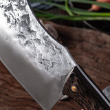 BladeCraft stainless steel chef knife on wooden cutting board | Sharp kitchen knife slicing vegetables with precision | Ergonomic chef knife with full-tang handle | BladeCraft knife cutting raw meat on butcher block | Stainless steel kitchen knife with sleek, modern design | High-performance BladeCraft knife in home kitchen | Chef holding BladeCraft knife while chopping herbs | Close-up of BladeCraft blade edge and handle grip | Professional-grade knife resting on chef apron | Versatile kitchen knife ideal 